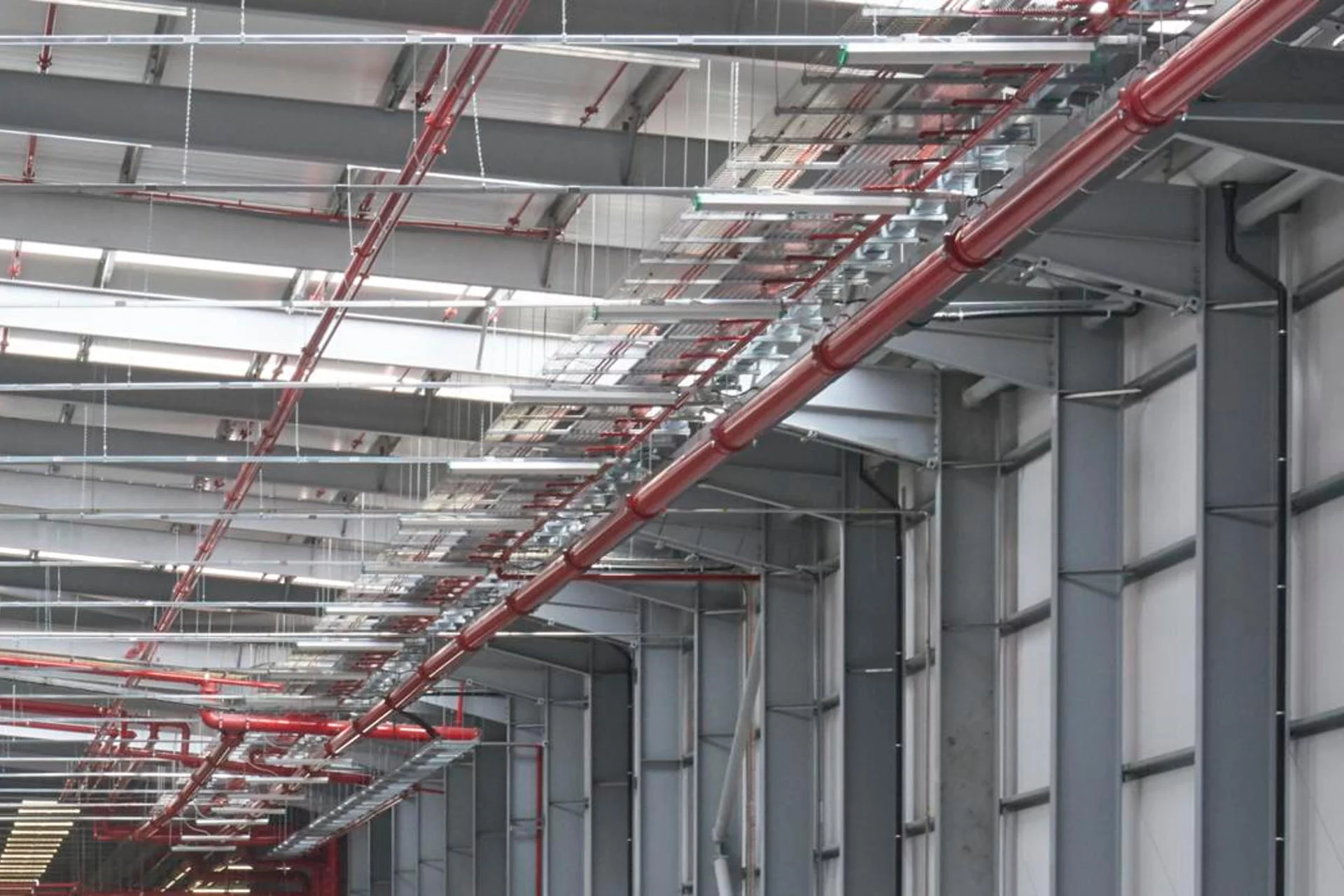 Industrial fire suppression piping and high-risk AFFF deluge system installed in the BAE Systems Eurofighter Hangar by Alpine Fire Engineers.